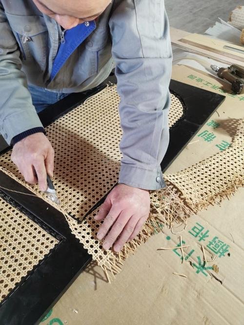 A close-up of a damaged sofa showing worn webbing needing replacement Sofa Underside Showing Webbing Repair