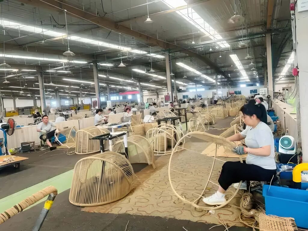 Chinese rattan factory workers processing cane weaving materials