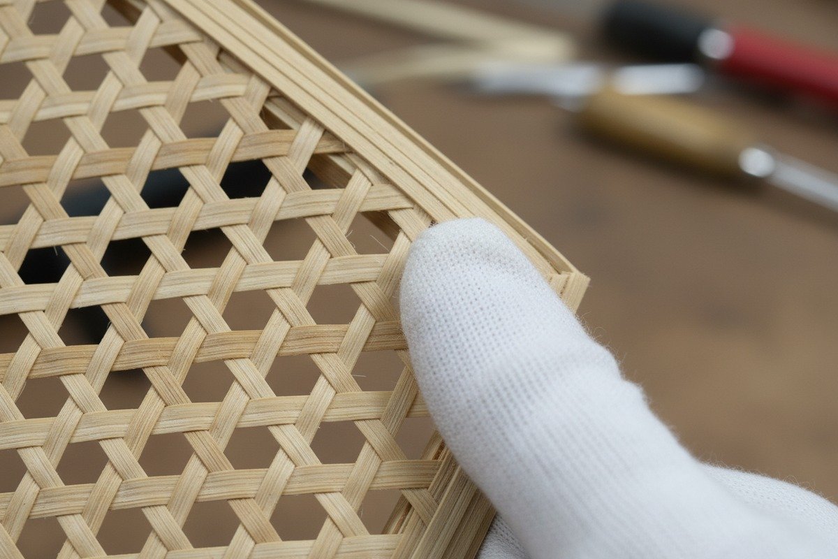 Traditional Hand-Weaving Process Close-up of traditional hand-woven LaHua rattan mesh showing natural irregularities at intersections (ID#2)