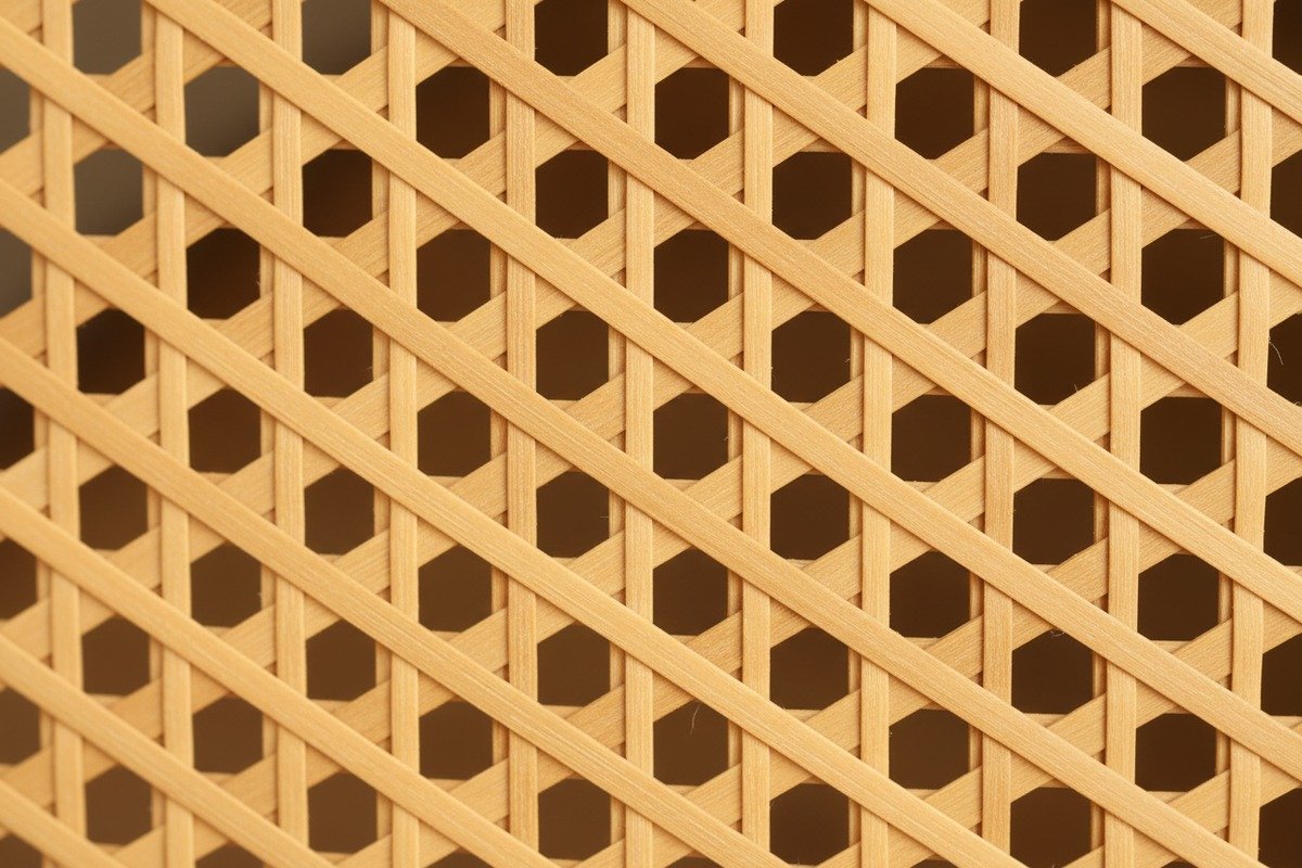 Durable rattan webbing installed on a large decorative screen with proper tensioning (ID#3)