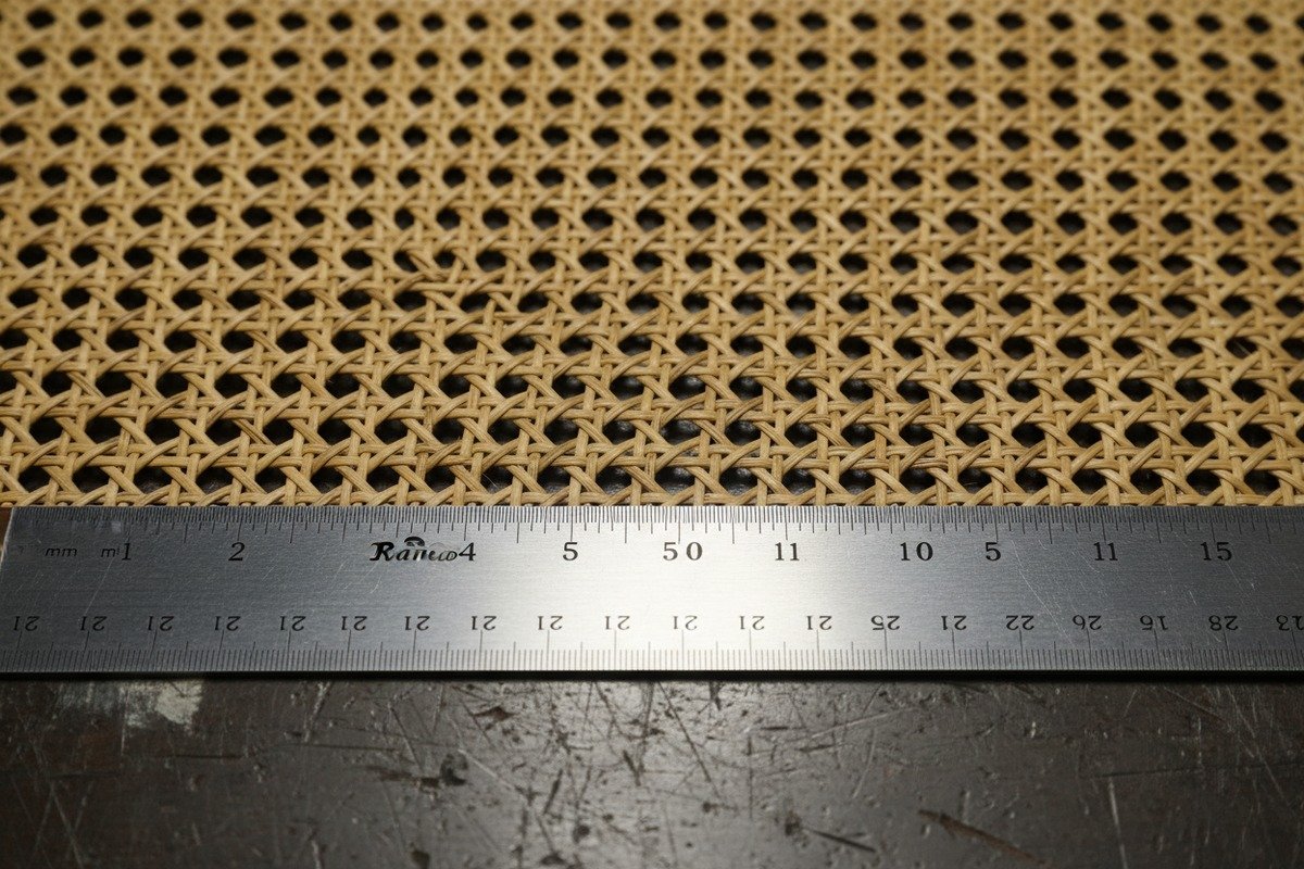Weaving Precision and Uniformity Close-up of uniform weaving precision and consistent hole sizes in quality rattan webbing (ID#4)